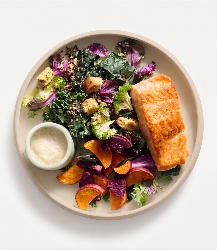 The Kale Collective Seared Salmon Caesar: seared salmon over a trio of kales with roasted yams